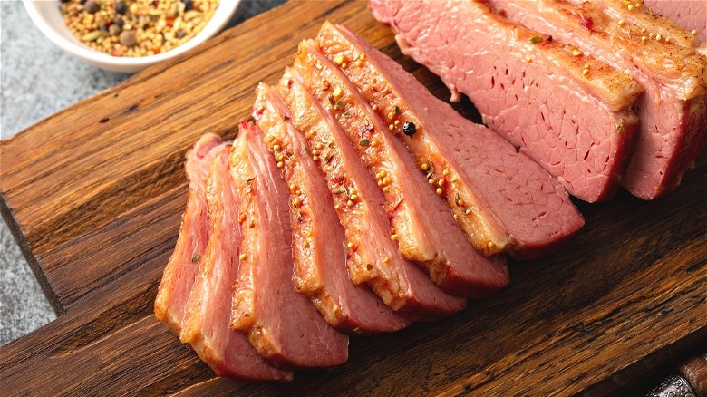 corned beef sliced on cutting board