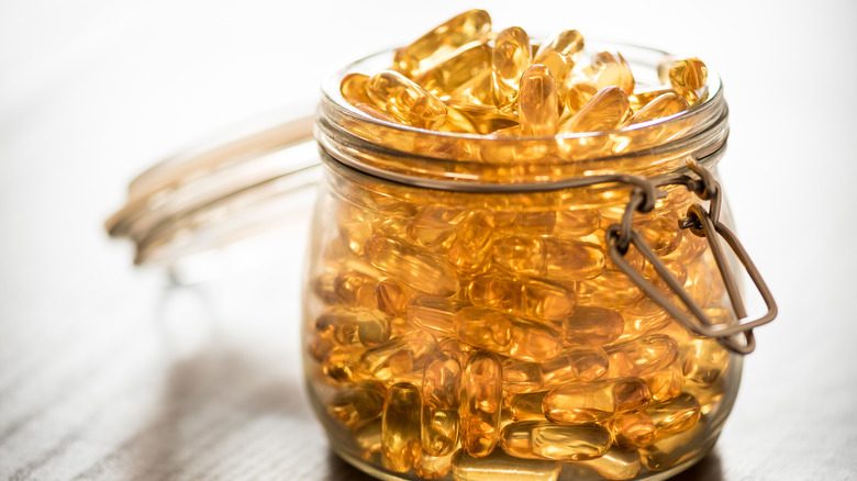 omega-3 capsules in glass jar