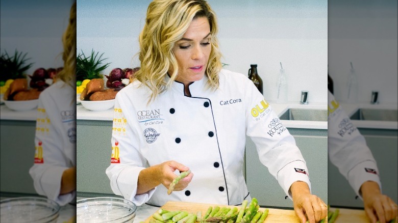 Cat Cora cooking with asparagus
