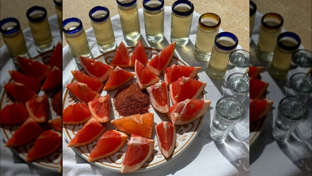 Tequila shots with grapefruit slices