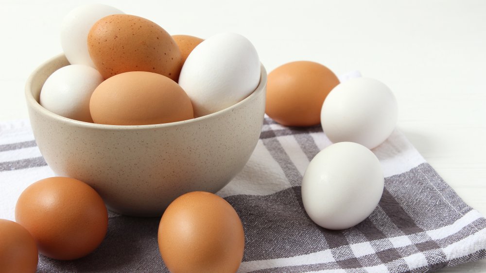 A bowl of brown and white eggs