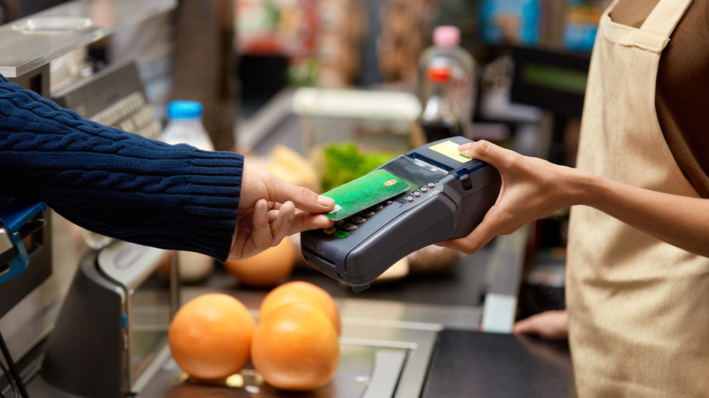 Person paying for groceries