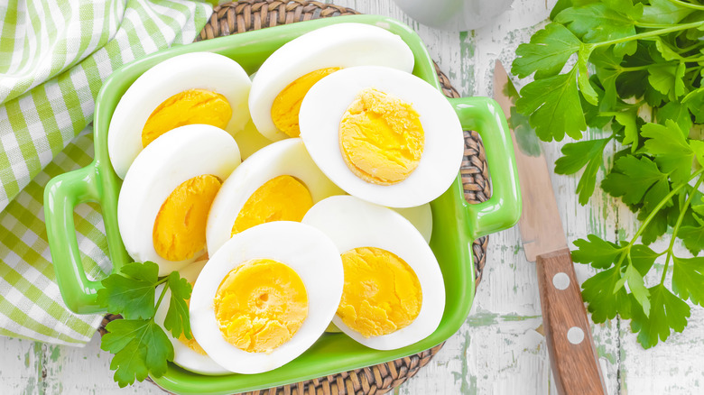 Hard-boiled egg halves with fresh parsley