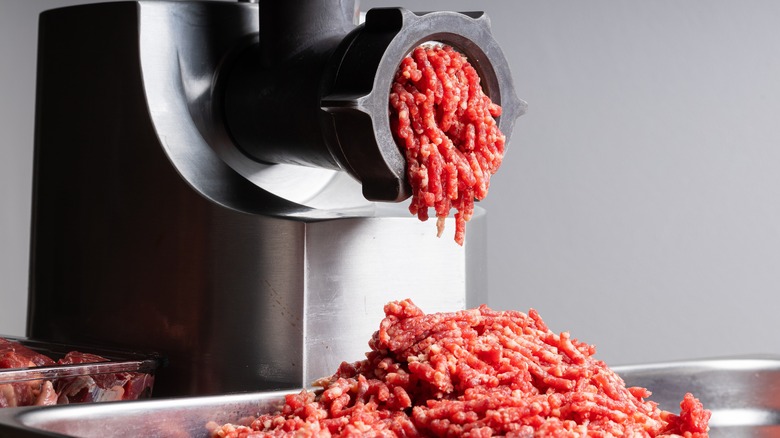 Fresh beef in meat grinder