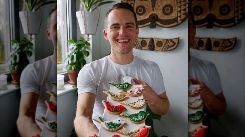 David Atherton holding cookies