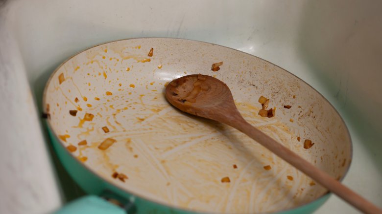 frying pan in sink