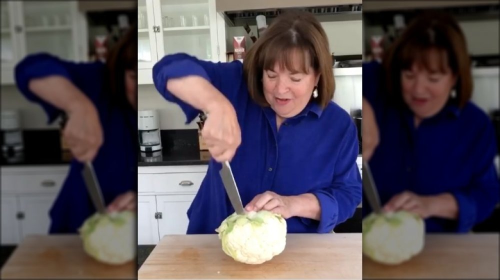 Ina Garten cutting a head of cauliflower