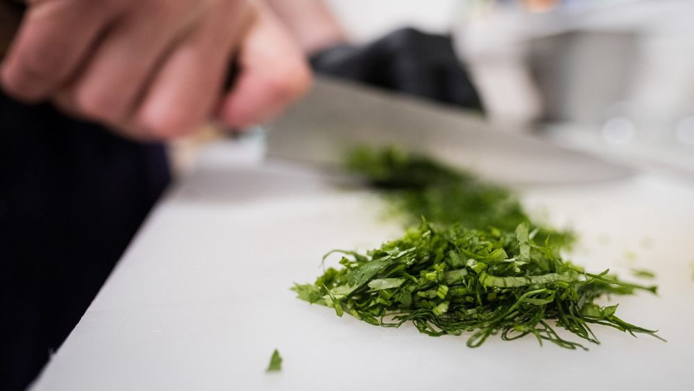 Chopped herbs on cutting board