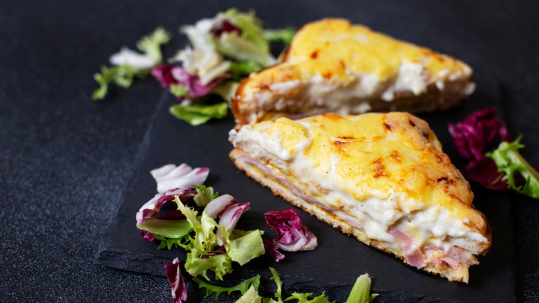 Croque Monsieur sandwich on a black background