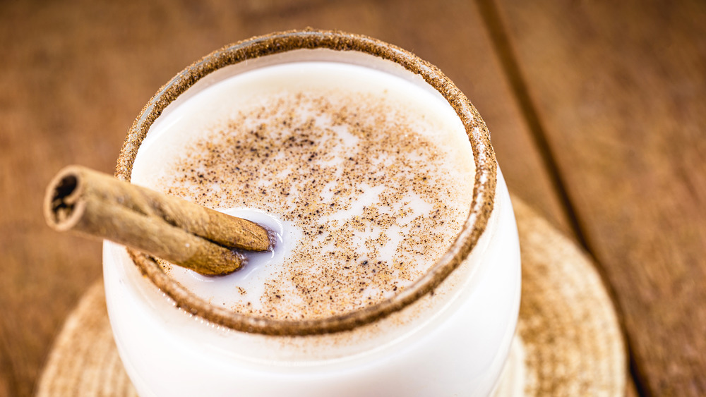 Festive Christmas drink with cinnamon stick garnish