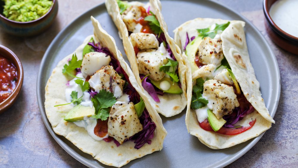 Trio of fish tacos on a plate 