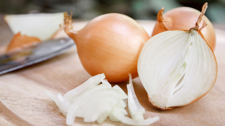 Sliced white onion on board