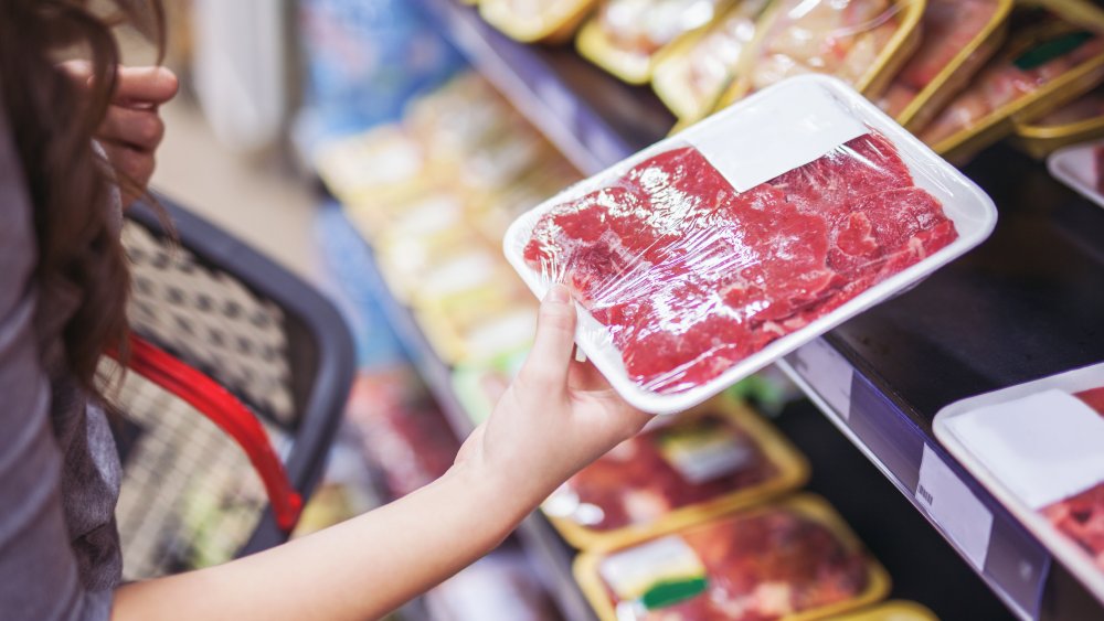 woman shopping for steak