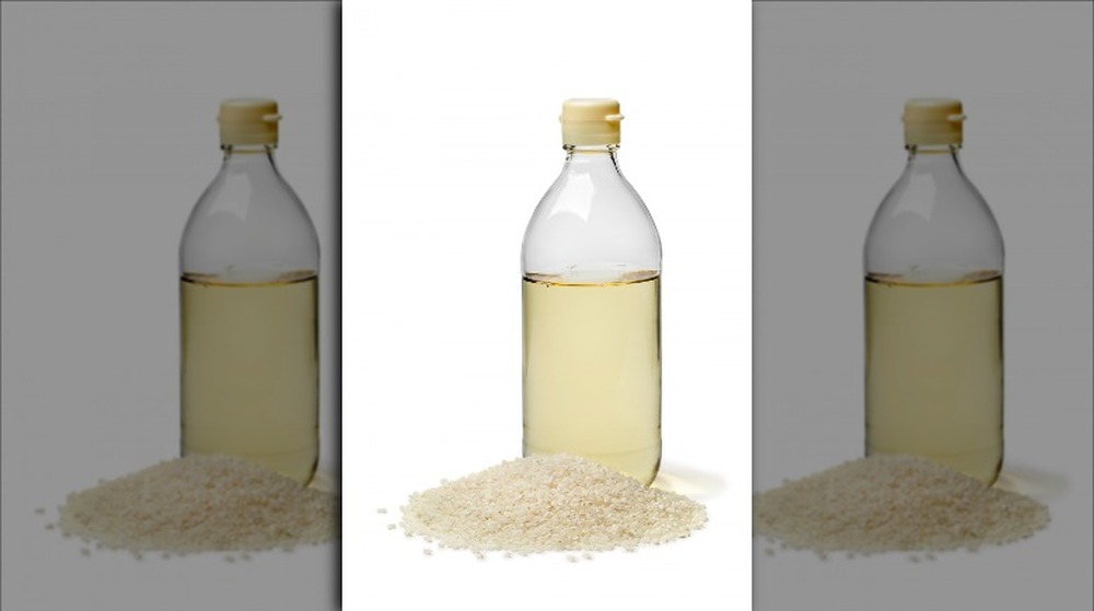 Bottle of Rice vinegar with glutinous rice grains