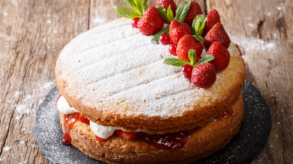 Victoria sponge cake topped with fruit