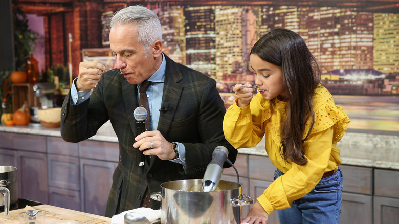 Geoffrey Zakarian eating from spoon