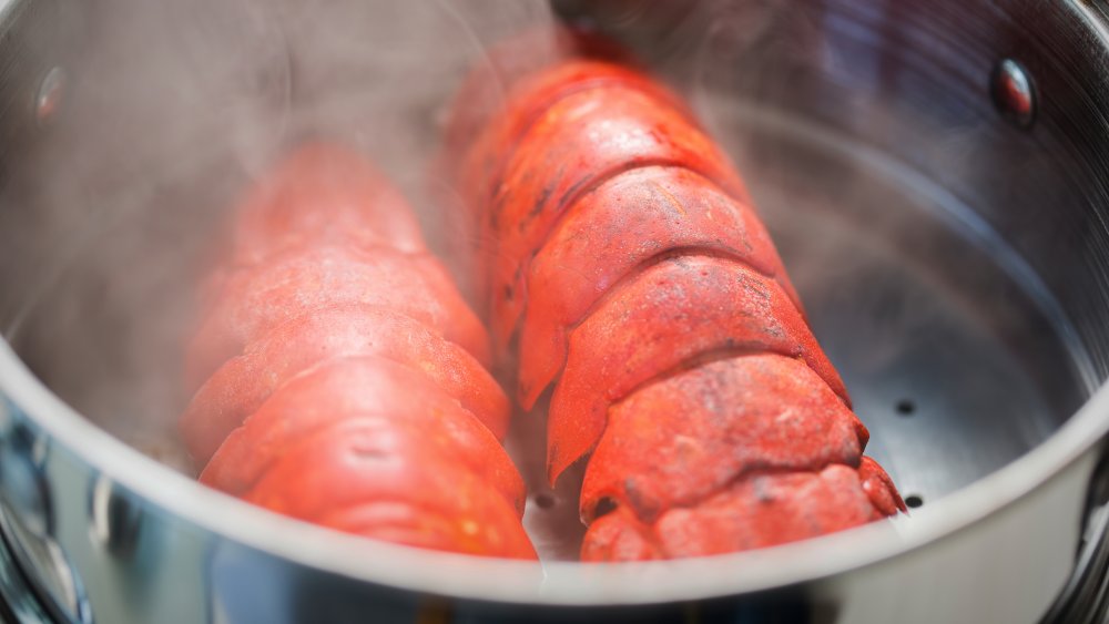 lobster tails steaming in a pot
