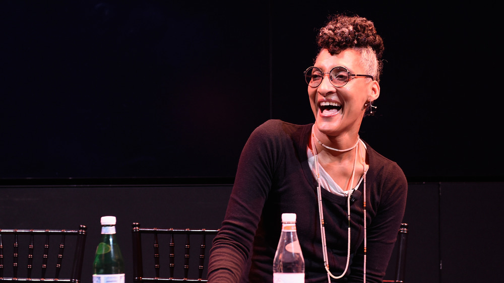 Chef Carla Hall laughing in a candid shot