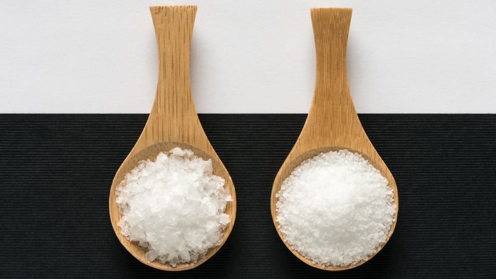 kosher salt and sea salt on wooden spoons 