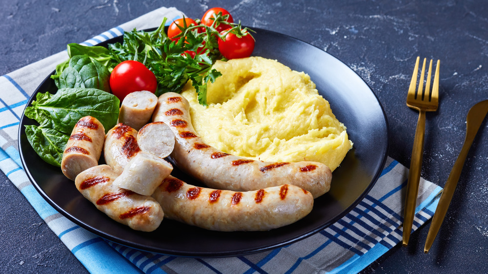 Aligot in a bowl with sausage