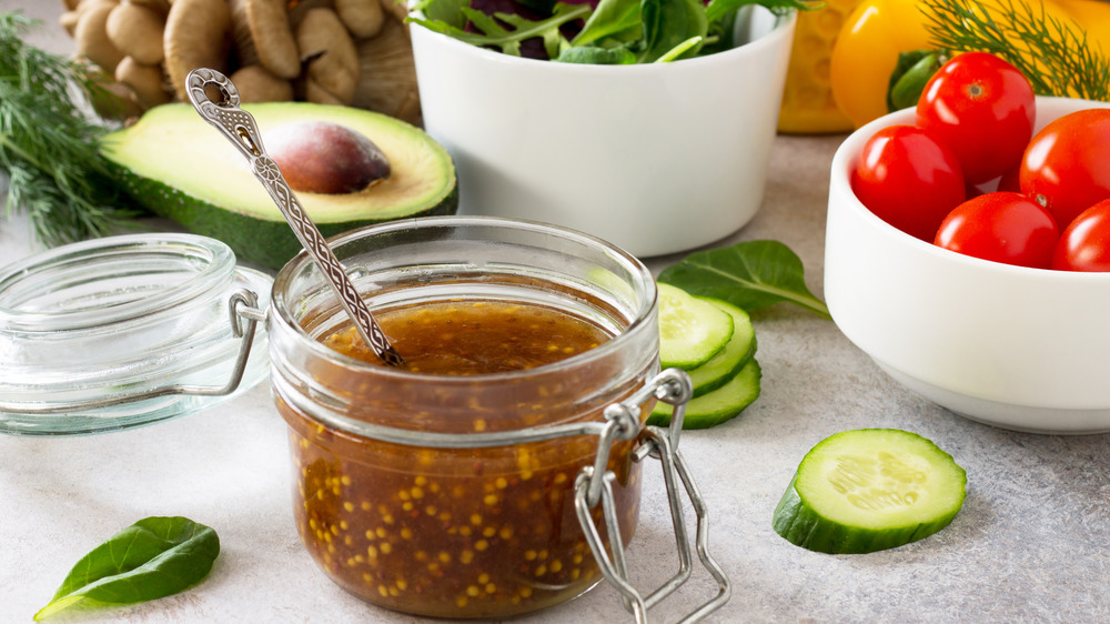 Mason jar of vinaigrette on a counter