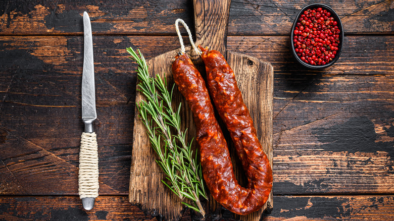 Spanish chorizo with knife and peppercorns