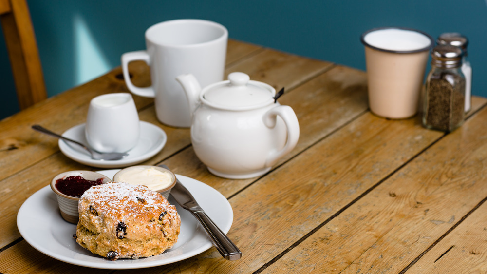 Scone with teapot and teacup