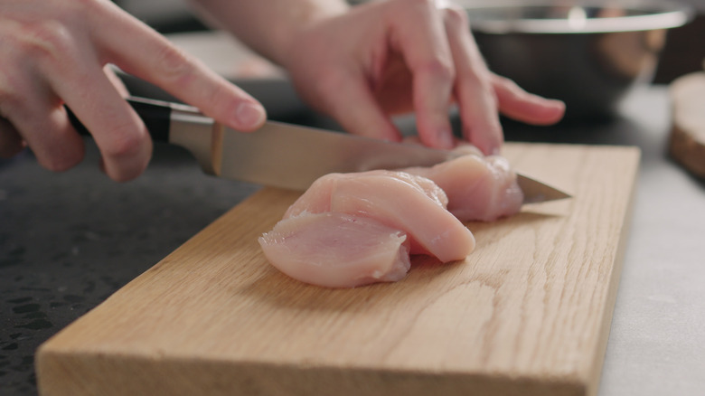 cutting chicken