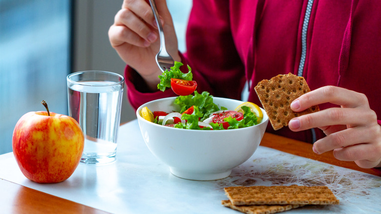 Person eating high fiber foods