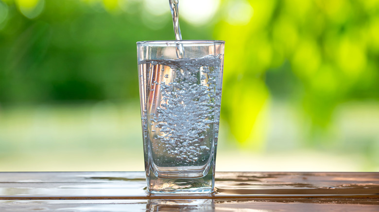 Glass of water being filled