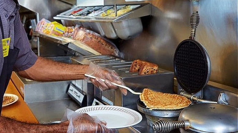 Man cooking waffle