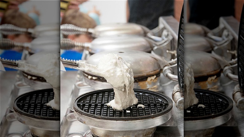 Batter poured on waffle iron