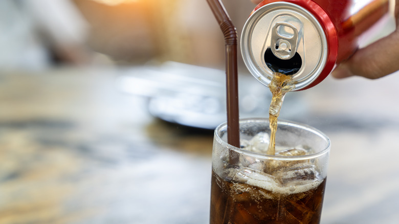 Diet coke pouring into glass