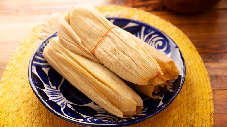 plate of wrapped tamales