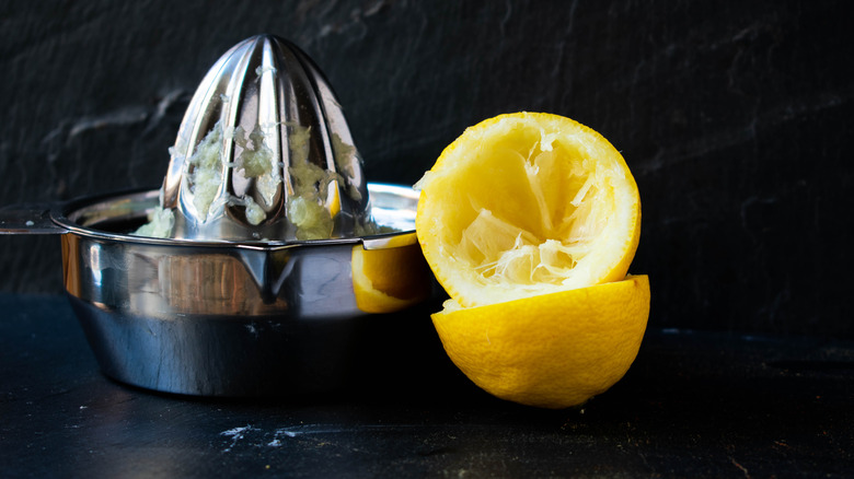 Lemon juicer with squeezed lemon halves