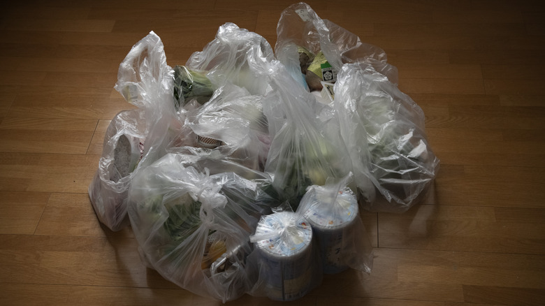 Multiple plastic bags with takeout containers