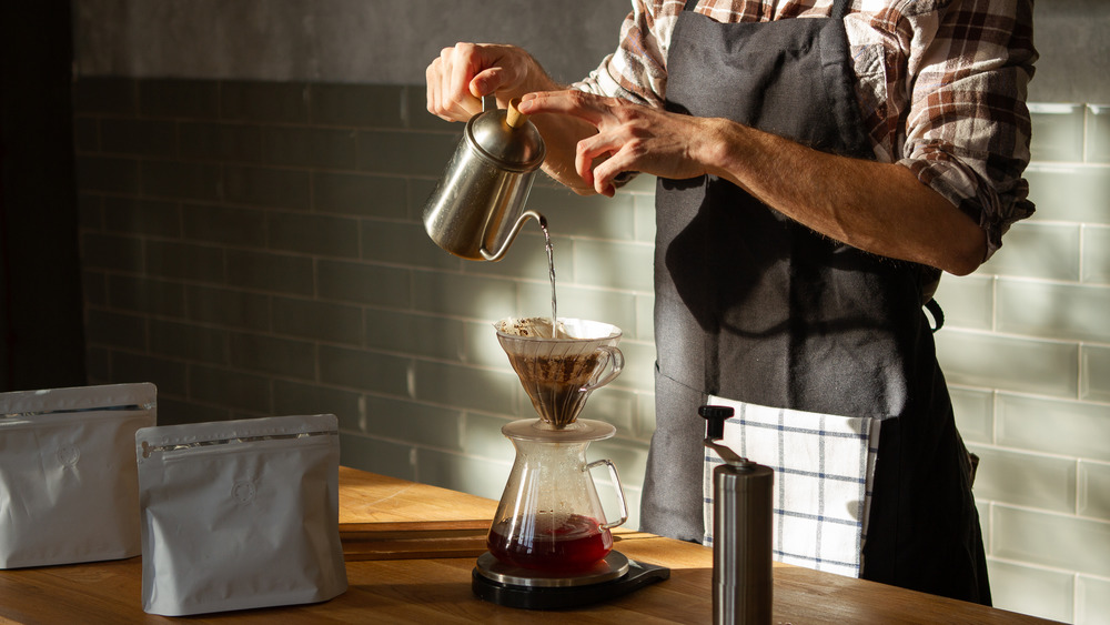 Barista making drip coffee