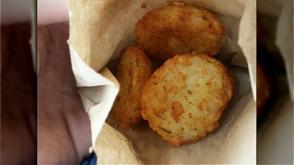 Dunkin hash browns in brown paper bag from above