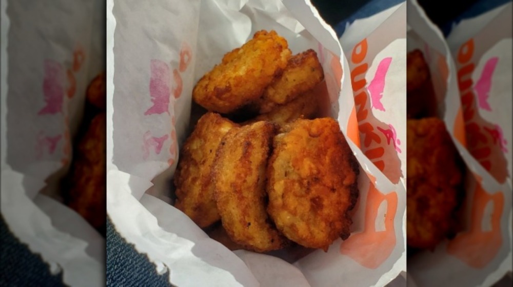 Dunkin' hash browns in paper bag