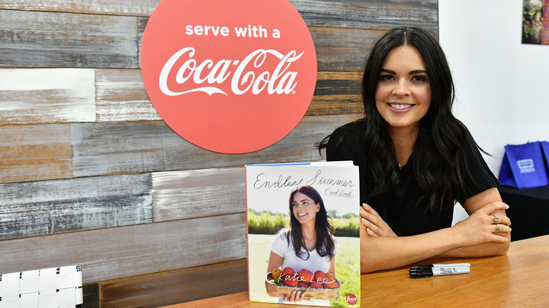 Katie Lee with her cookbook