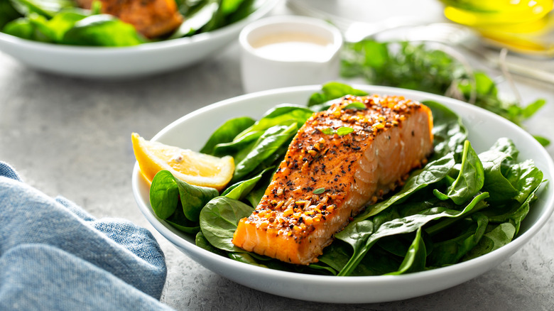 Spinach and salmon in bowl