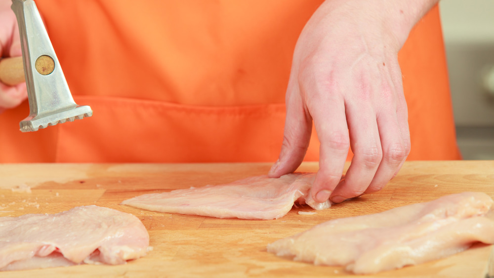 tenderizing chicken with meat mallet