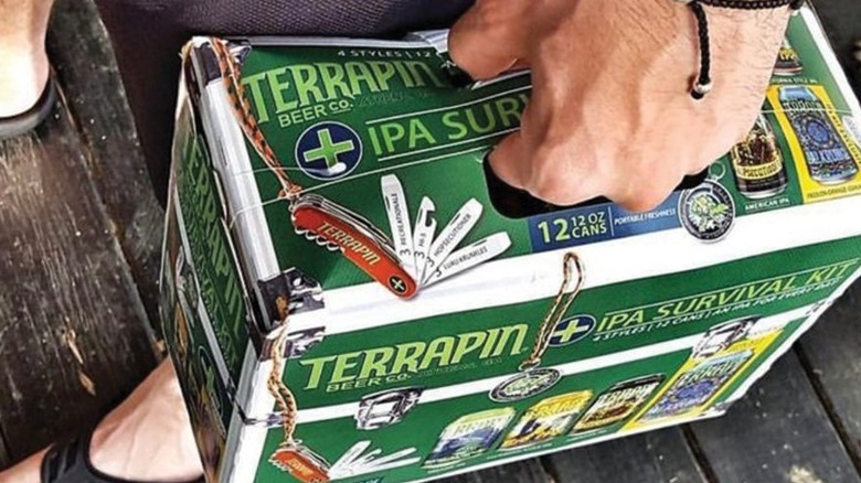 person holding terrapin ipa 12-pack