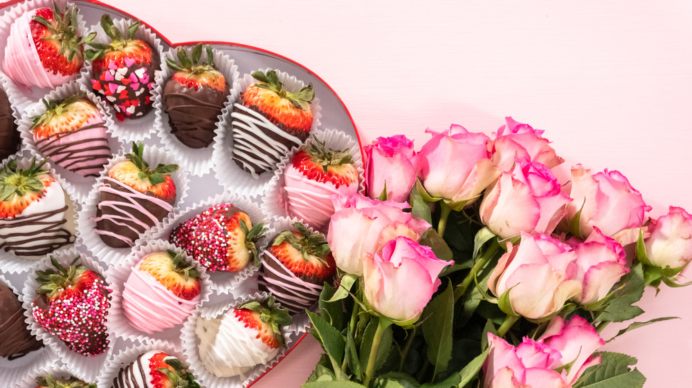 Chocolate-covered strawberries and roses