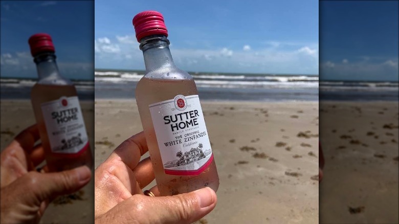 white zinfandel bottle on beach