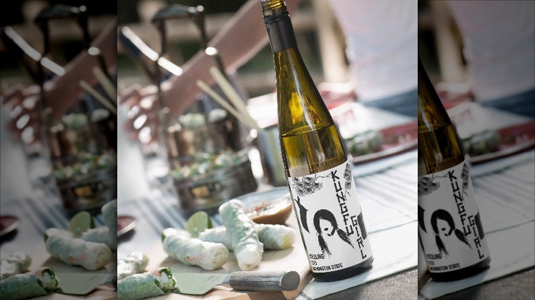 riesling bottle with spring rolls