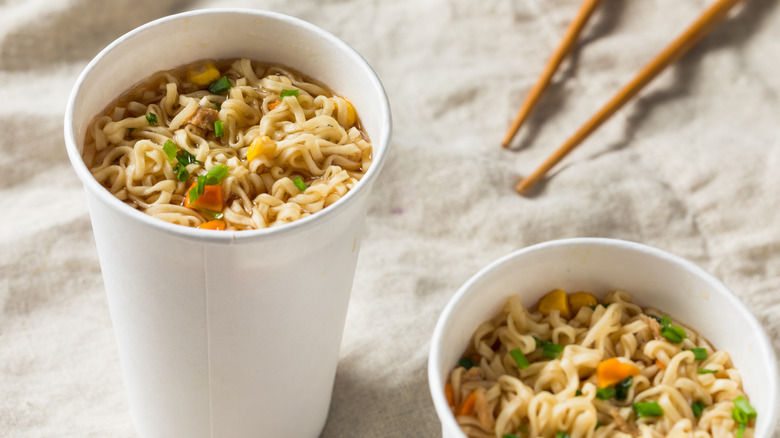 Two cup noodles with chopsticks