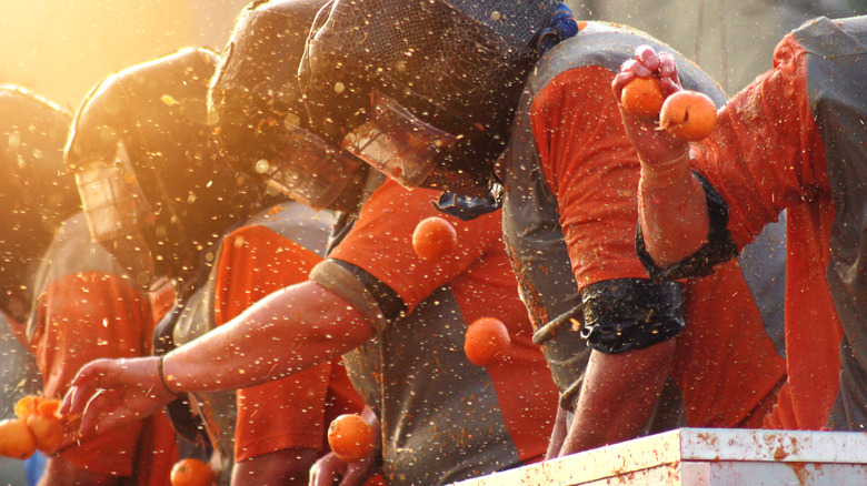 Battle of the Oranges participants in helmets