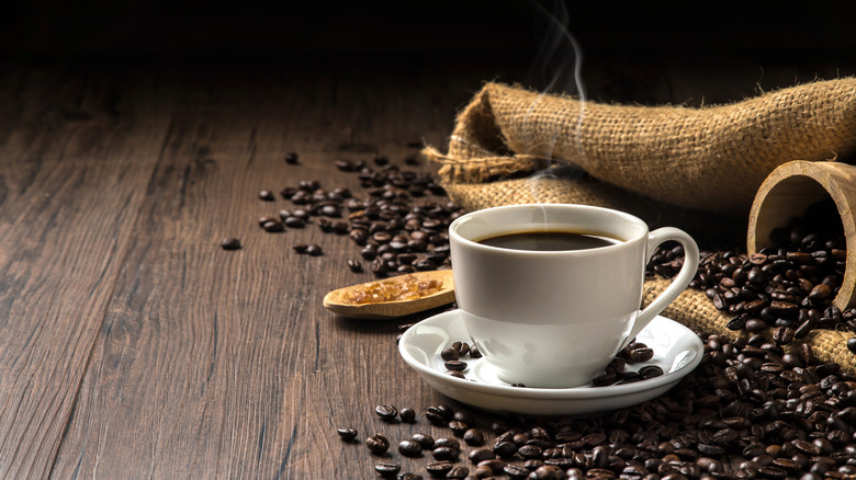 Mug of coffee and beans