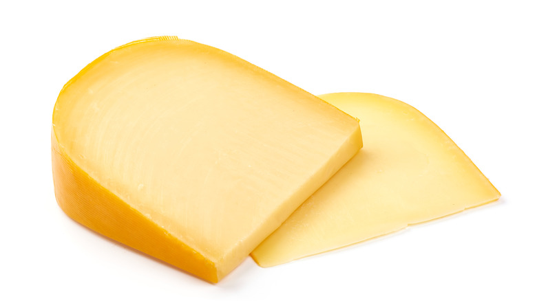 Gouda cheese on white background